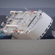 Illustration for article titled These Photos Of That Grounded Car Carrier Ship Are Beautifully Surreal